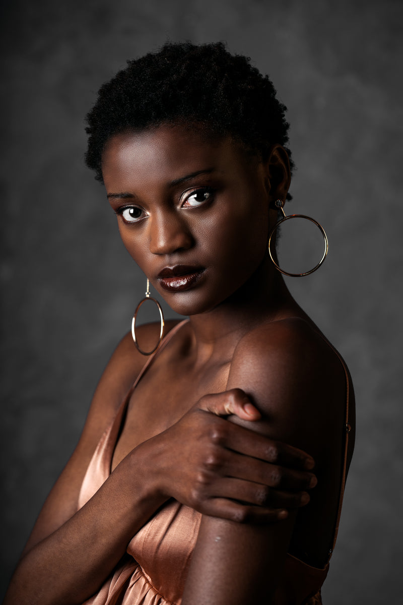 Fashion model showcasing Radiant Glows beauty products